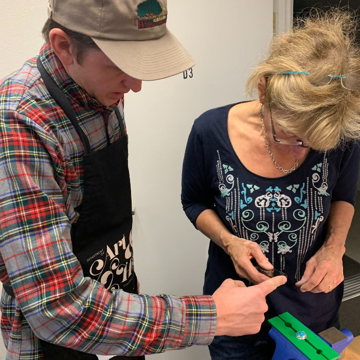 Instructor Alec helping a student