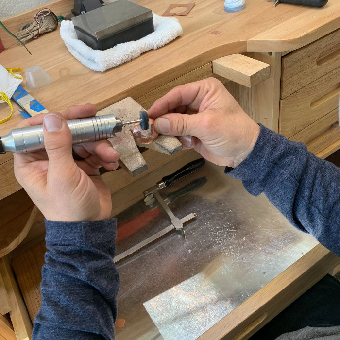 Polishing at student bench at Silver Peak Studio